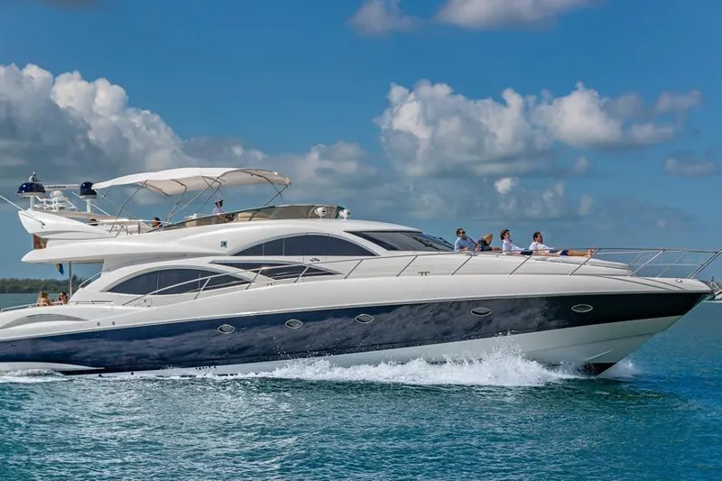  Yacht Photos Pics Luxury Sunseeker Manhattan 74 yacht cruising on blue ocean, 2000 model.