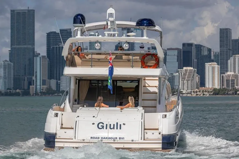  Yacht Photos Pics Sunseeker Manhattan 74 yacht cruising near city skyline, 2000 model.