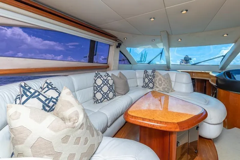  Yacht Photos Pics Luxurious interior of 2000 Sunseeker Manhattan 74 yacht with plush seating and elegant decor.