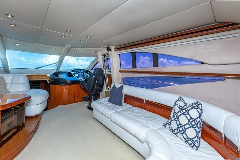  Yacht Photos Pics Luxurious interior of 2000 Sunseeker Manhattan 74 yacht with plush seating and ocean view.