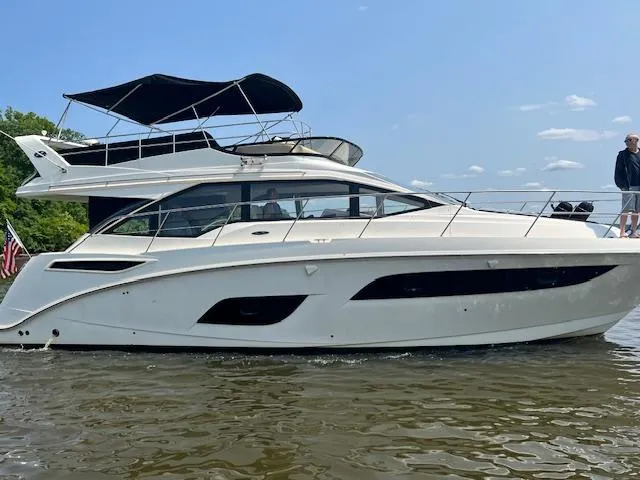  Yacht Photos Pics 2017 Sea Ray Fly 460 yacht on water, featuring sleek design and spacious flybridge.