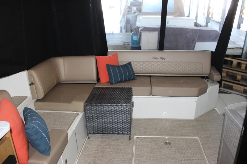  Yacht Photos Pics Luxurious 2017 Sea Ray Fly 460 yacht interior with beige seating and colorful cushions.