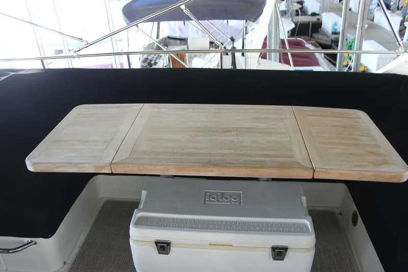  Yacht Photos Pics 2017 Sea Ray Fly 460 yacht interior with wooden table and cooler.