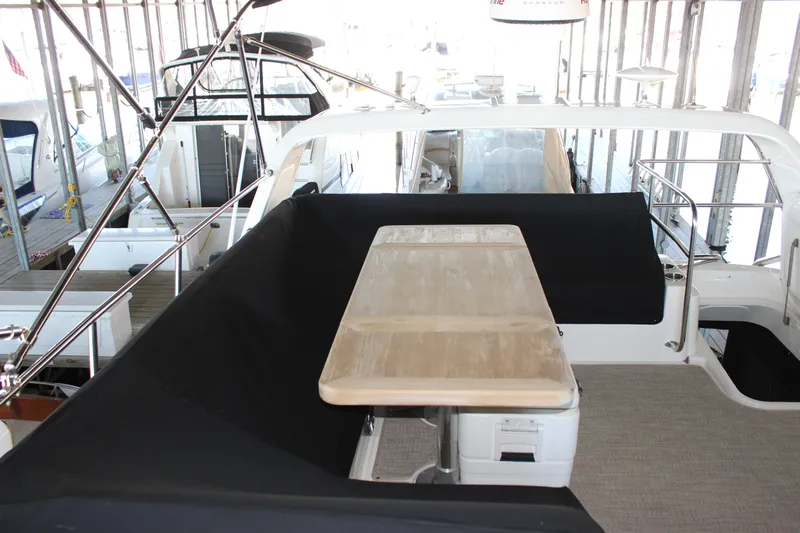  Yacht Photos Pics 2017 Sea Ray Fly 460 yacht interior with dining table and seating area.