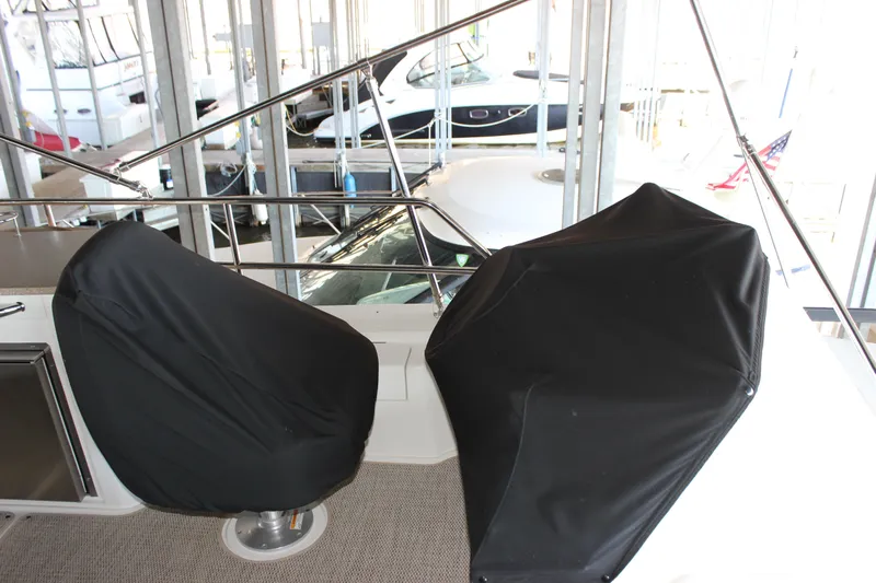  Yacht Photos Pics 2017 Sea Ray Fly 460 yacht interior with covered seats in a marina.