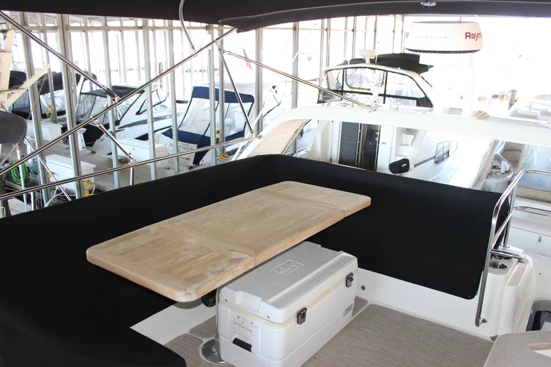  Yacht Photos Pics 2017 Sea Ray Fly 460 yacht interior with table and cooler on deck.