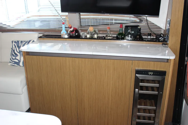  Yacht Photos Pics 2017 Sea Ray Fly 460 yacht interior with bar and wine cooler.
