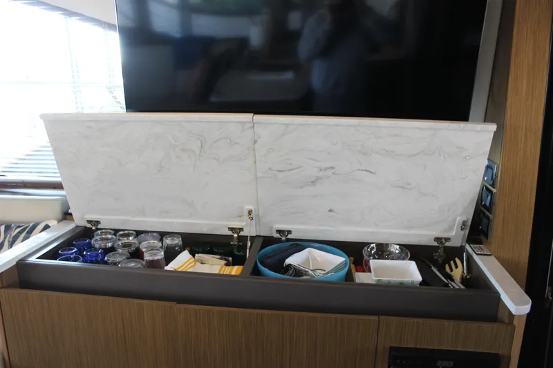  Yacht Photos Pics Interior storage compartment on 2017 Sea Ray Fly 460 yacht, featuring organized kitchenware.