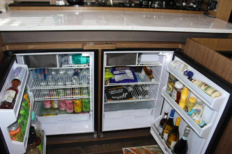  Yacht Photos Pics Dual refrigerators stocked with beverages and condiments on a 2017 Sea Ray Fly 460 yacht.
