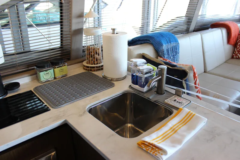  Yacht Photos Pics Modern kitchen area in 2017 Sea Ray Fly 460 yacht with sink and seating.