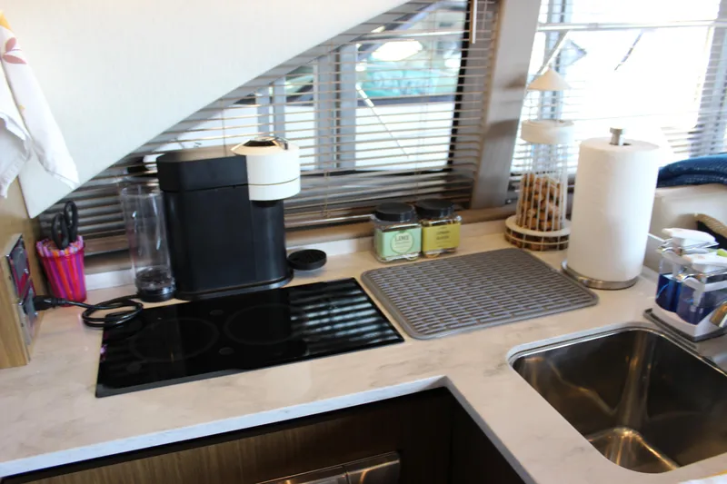  Yacht Photos Pics Modern kitchen area in a 2017 Sea Ray Fly 460 yacht with appliances and sink.