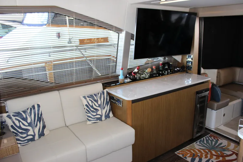  Yacht Photos Pics Luxurious interior of 2017 Sea Ray Fly 460 yacht with modern decor and entertainment setup.