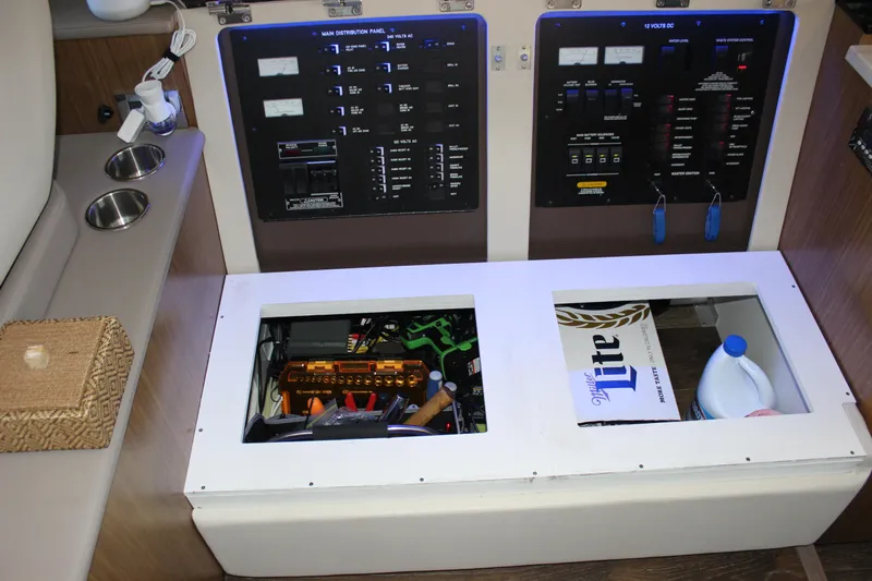  Yacht Photos Pics Electrical panel and storage compartments in a 2017 Sea Ray Fly 460 yacht interior.