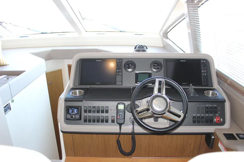  Yacht Photos Pics 2017 Sea Ray Fly 460 helm with modern navigation equipment and steering wheel.