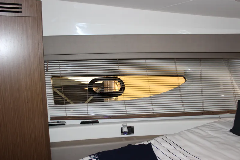  Yacht Photos Pics Interior view of 2017 Sea Ray Fly 460 yacht cabin with window blinds.