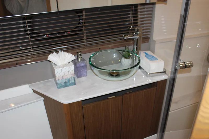  Yacht Photos Pics Luxurious bathroom on 2017 Sea Ray Fly 460 yacht with glass sink and modern fixtures.