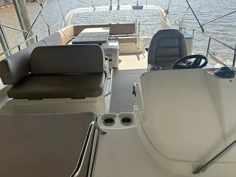  Yacht Photos Pics 2017 Sea Ray Fly 460 yacht interior with seating and helm, overlooking water.