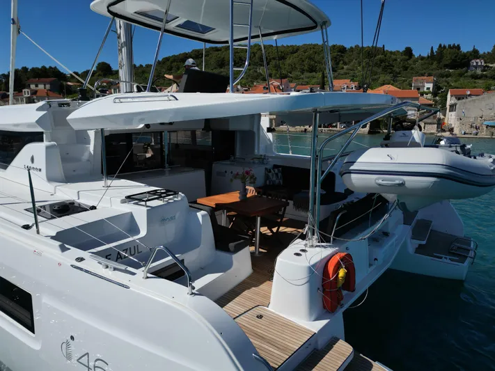 Mare Azul Yacht Photos Pics 2024 Lagoon 46 catamaran docked, featuring spacious deck and modern design.