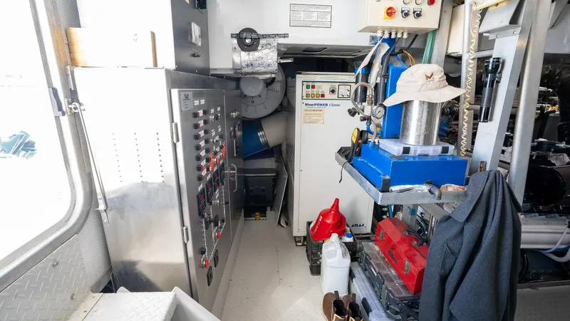  Yacht Photos Pics Interior of 1999 Burger 85 Deck house, featuring control panels and equipment.