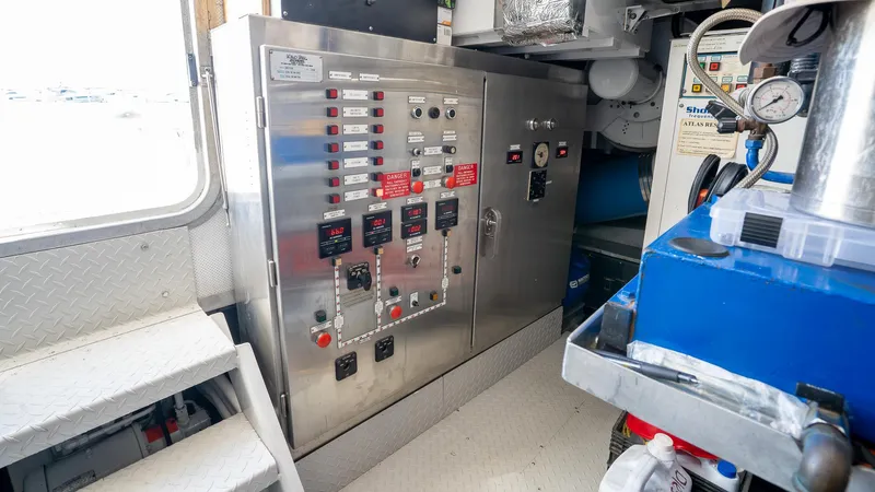  Yacht Photos Pics Control panel inside 1999 Burger 85 Deck house, featuring various switches and gauges.