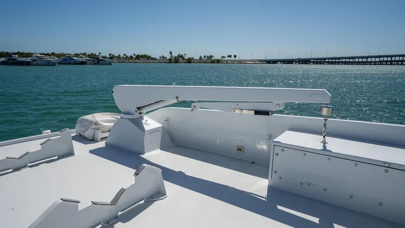  Yacht Photos Pics 1999 Burger 85 Deck House yacht deck with ocean view and clear blue sky.