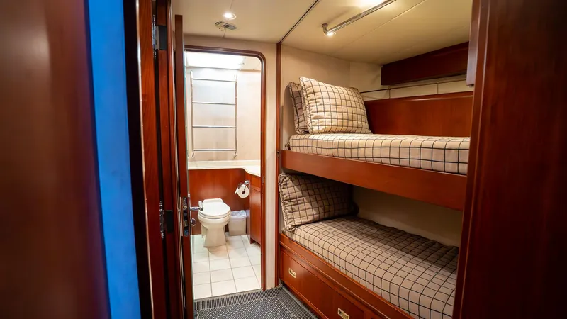  Yacht Photos Pics Interior of 1999 Burger 85 Deck house with bunk beds and bathroom.