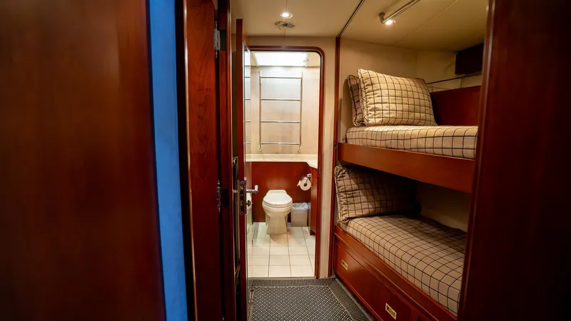  Yacht Photos Pics Interior of 1999 Burger 85 Deck house with bunk beds and bathroom.