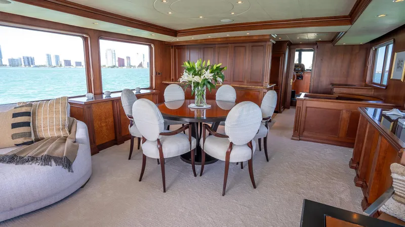  Yacht Photos Pics Luxurious interior of 1999 Burger 85 Deck house yacht with elegant dining area.