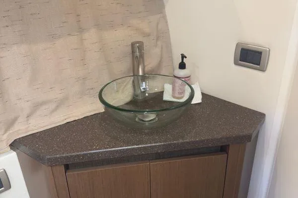  Yacht Photos Pics Glass sink and faucet on a Sea Ray 400 Sundancer 2016 yacht bathroom counter.