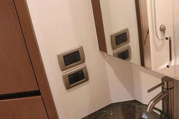  Yacht Photos Pics Bathroom interior of 2016 Sea Ray 400 Sundancer yacht with modern fixtures and mirror.