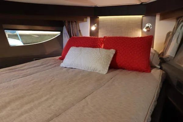  Yacht Photos Pics Luxurious cabin interior of 2016 Sea Ray 400 Sundancer with cozy bedding.