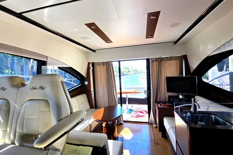  Yacht Photos Pics Luxurious interior of 2016 Sea Ray Sundancer 400 yacht with elegant seating and scenic view.