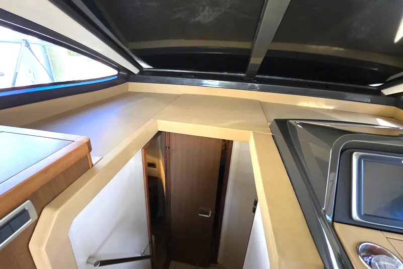  Yacht Photos Pics Interior view of 2016 Sea Ray Sundancer 400 yacht, featuring modern design and wood finishes.