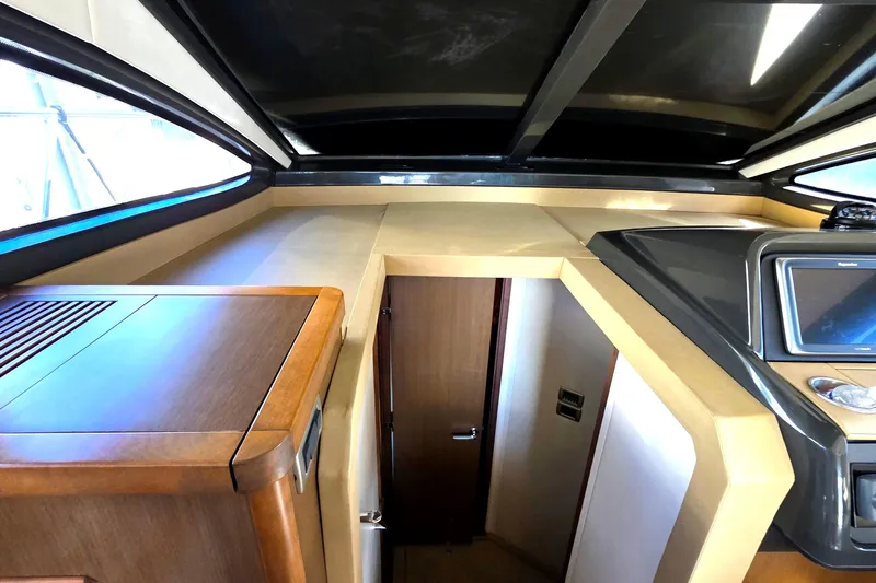  Yacht Photos Pics Interior view of 2016 Sea Ray Sundancer 400 yacht, featuring sleek wood cabinetry and modern design.