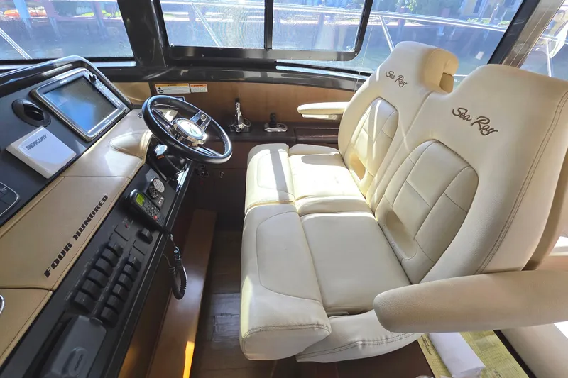  Yacht Photos Pics Interior of 2016 Sea Ray Sundancer 400 yacht with plush seating and modern controls.