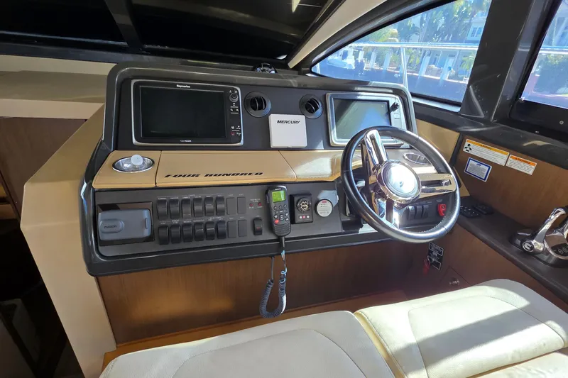  Yacht Photos Pics 2016 Sea Ray Sundancer 400 helm with modern controls and navigation systems.