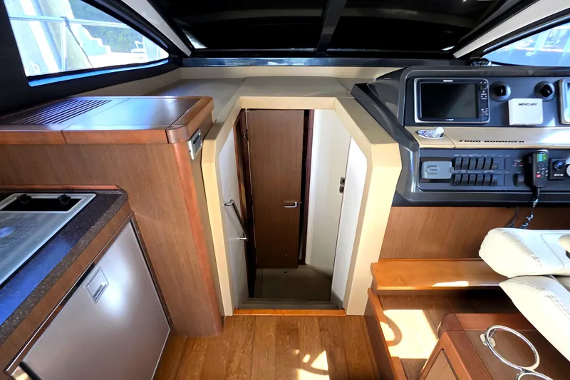  Yacht Photos Pics Interior of 2016 Sea Ray Sundancer 400 yacht, featuring helm and galley area.
