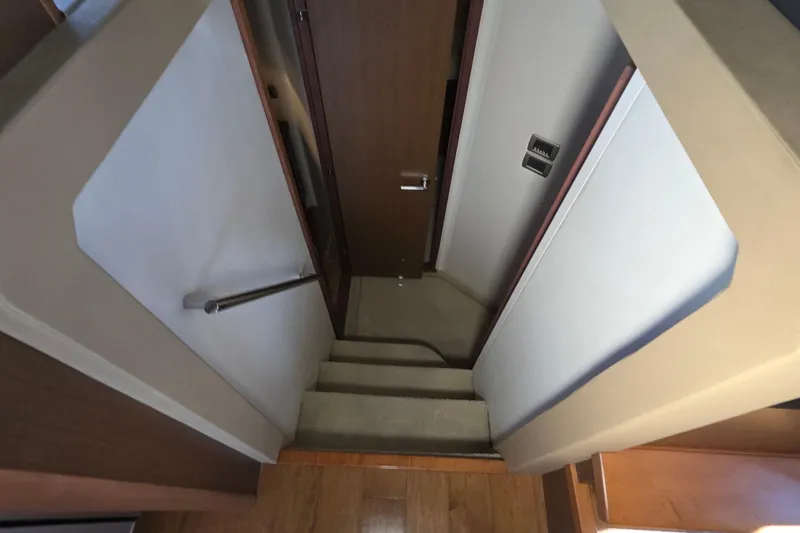  Yacht Photos Pics Interior stairs of 2016 Sea Ray Sundancer 400 yacht, featuring sleek design and wooden finish.