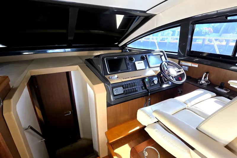  Yacht Photos Pics 2016 Sea Ray Sundancer 400 helm with modern controls and comfortable seating.