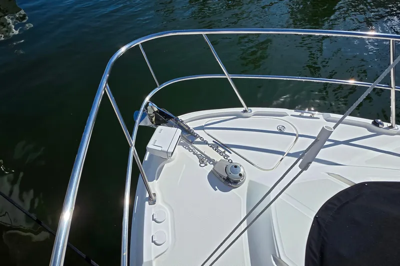  Yacht Photos Pics Bow of 2016 Sea Ray Sundancer 400 with anchor and railing, on calm water.