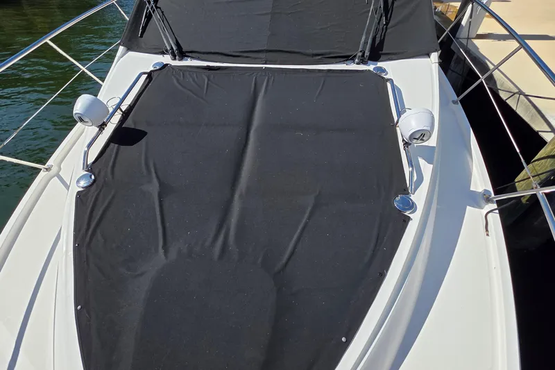  Yacht Photos Pics 2016 Sea Ray Sundancer 400 boat deck with black cover and railing.