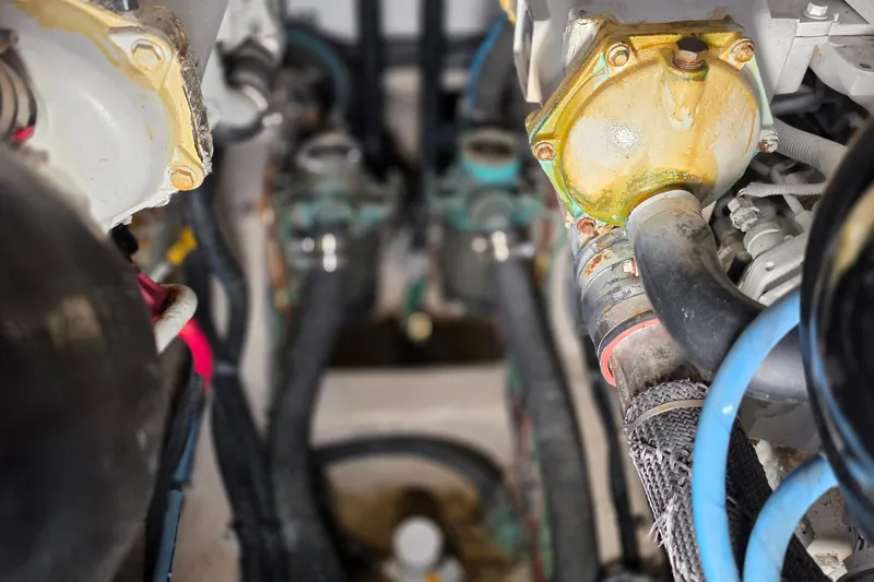  Yacht Photos Pics Engine room of 2016 Sea Ray Sundancer 400 with visible hoses and components.