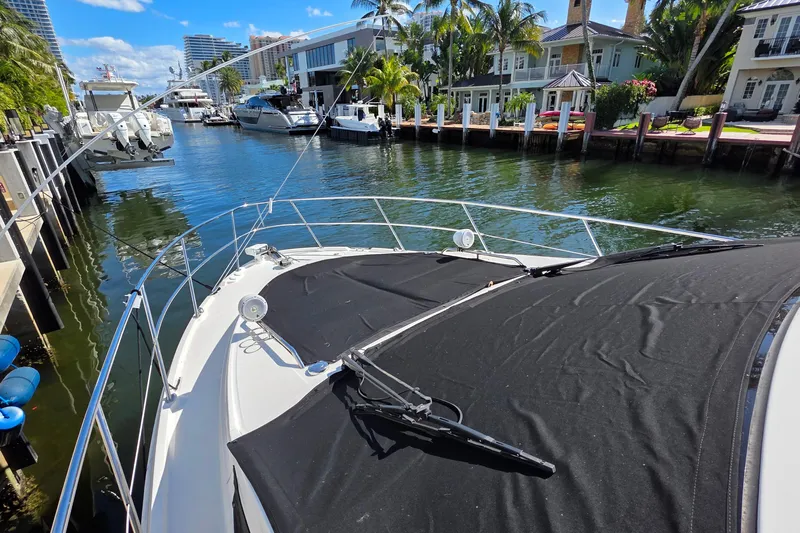  Yacht Photos Pics 2016 Sea Ray Sundancer 400 yacht docked in a scenic waterfront area.