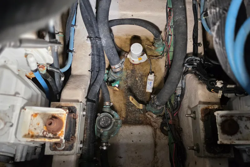  Yacht Photos Pics Engine compartment of a 2016 Sea Ray Sundancer 400 with visible hoses and wiring.