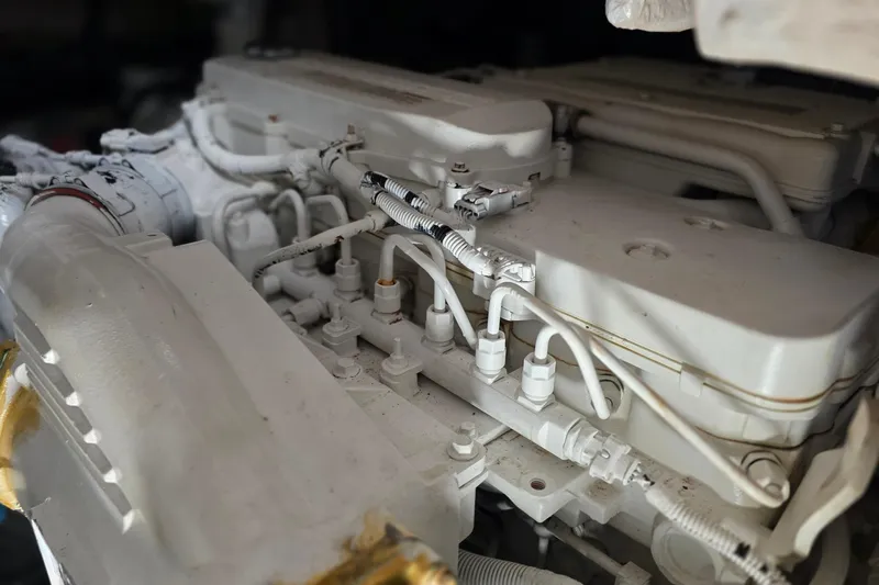  Yacht Photos Pics Engine compartment of a 2016 Sea Ray Sundancer 400 yacht, showcasing detailed mechanical components.