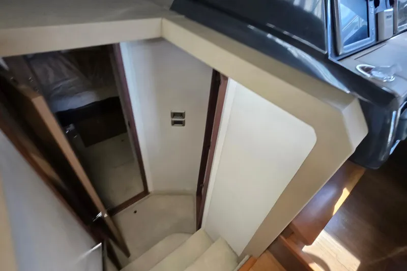  Yacht Photos Pics Interior view of 2016 Sea Ray Sundancer 400 yacht, showing cabin entrance and stairs.