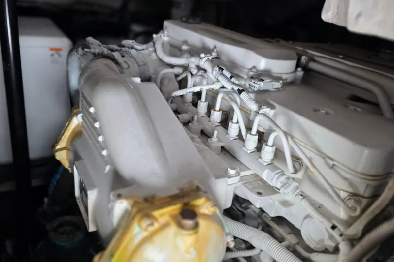  Yacht Photos Pics Engine compartment of a 2016 Sea Ray Sundancer 400 boat, showcasing detailed mechanical components.