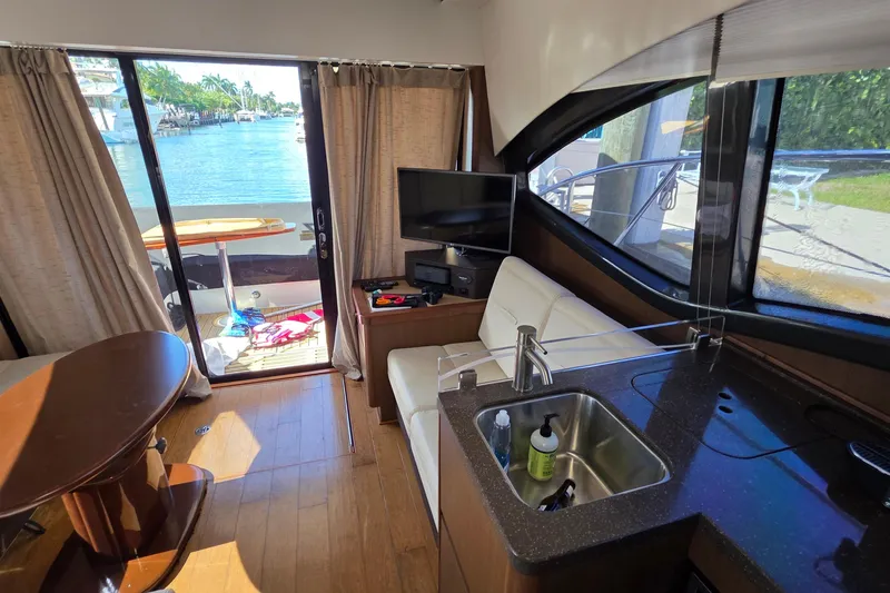  Yacht Photos Pics Interior of 2016 Sea Ray Sundancer 400 yacht with modern amenities and waterfront view.