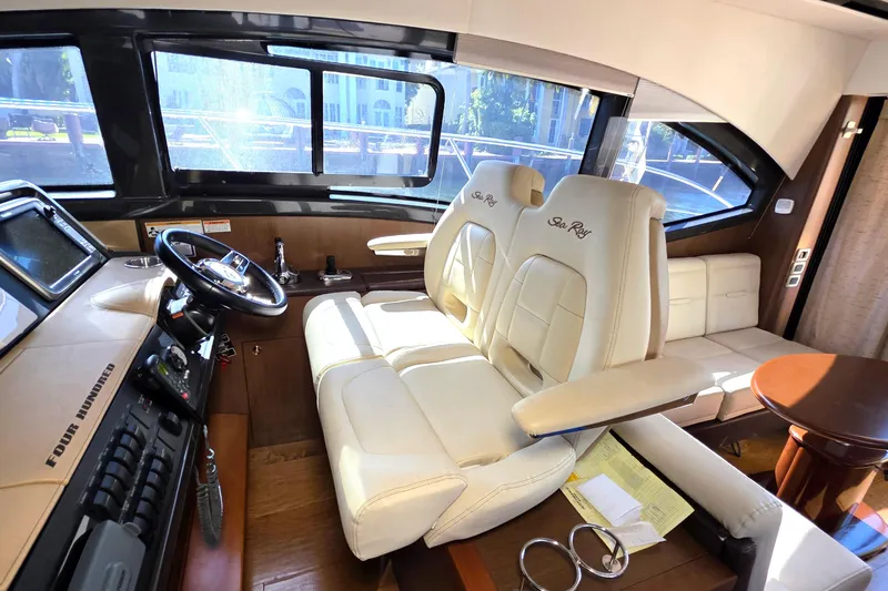  Yacht Photos Pics Interior of 2016 Sea Ray Sundancer 400 yacht with luxurious seating and helm.