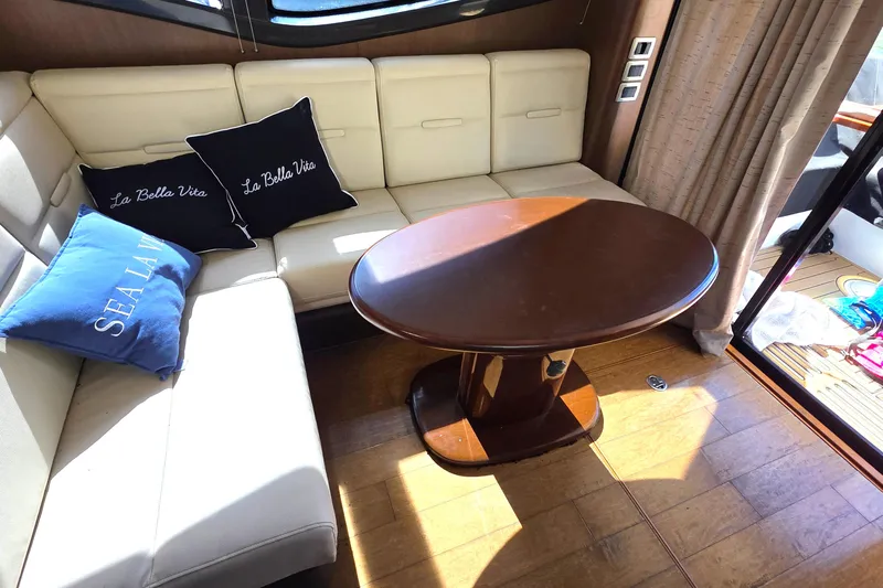  Yacht Photos Pics Luxurious 2016 Sea Ray Sundancer 400 interior with elegant seating and stylish wooden table.